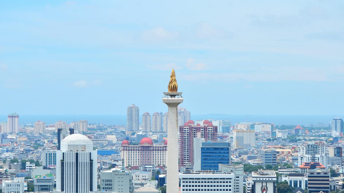 Jakarta National Monument and CBD skyline — Indonesia stay, earn and tax hub