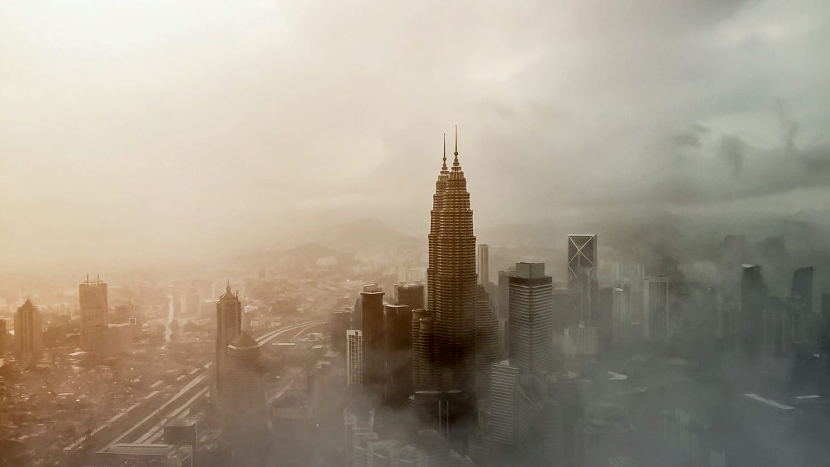 Petronas towers above mist — Employment Pass