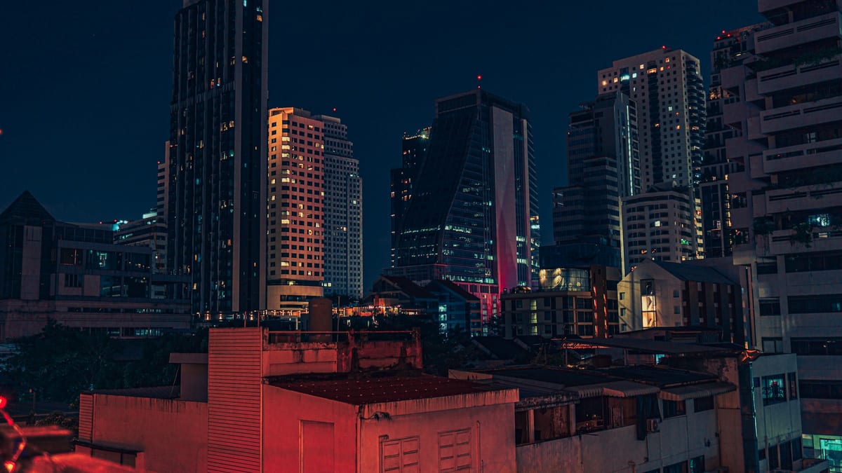 Bangkok CBD rooftop night skyline — Thailand stay, earn and tax hub