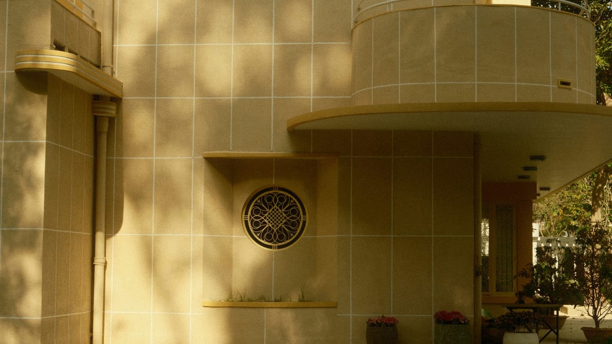 Modernist building facade with geometric circular window in Ho Chi Minh City