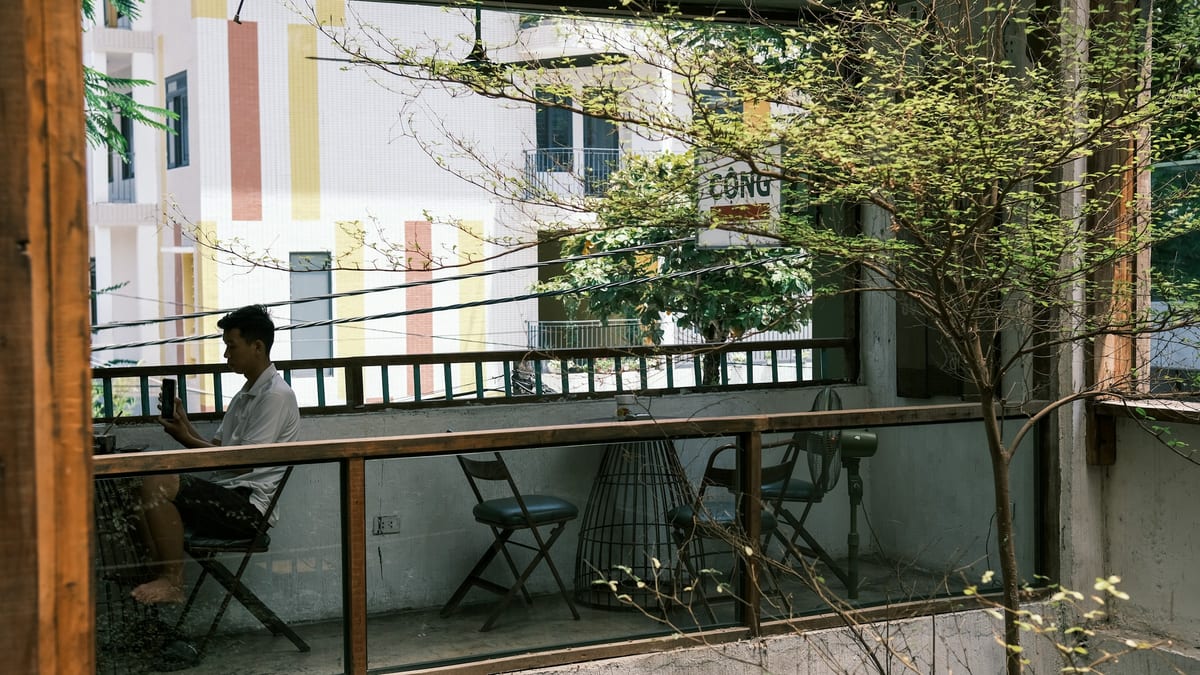 Cafe balcony overlooking apartment blocks in Ho Chi Minh City