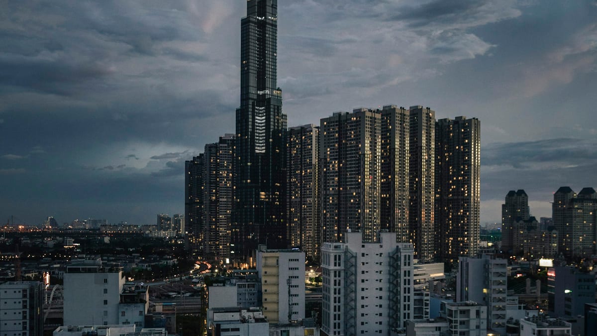 Landmark 81 at dusk above residential towers in Ho Chi Minh City