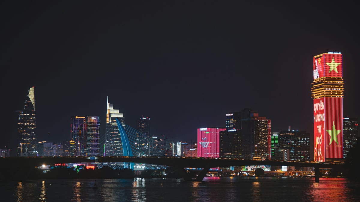 Ho Chi Minh City District 1 skyline at night — Vietnam tax machine