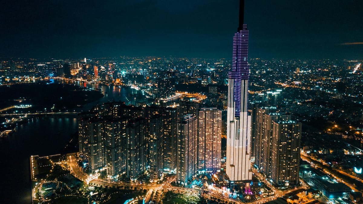 Landmark 81 and surrounding towers at night in Ho Chi Minh City
