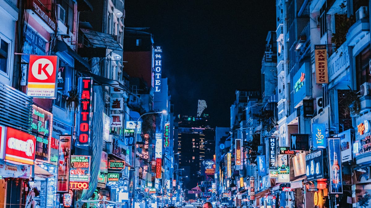 Dense night street under Bitexco in Ho Chi Minh City